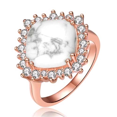 Diamond Essence Ring With How Lite Center Surrounded By Melee Set In 8  Prongs In Rose Plated Sterling Silver.