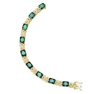 gold bracelet with emerald stone