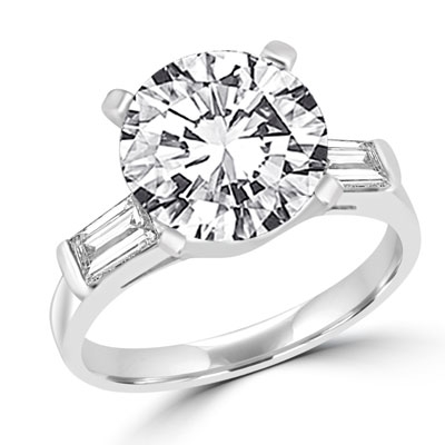 A 3.5 carats Diamond Essence round brilliant stone in center with baguettes  on each sides set in 14K Solid White Gold. 4.0 cts. t.w. Once you have it 